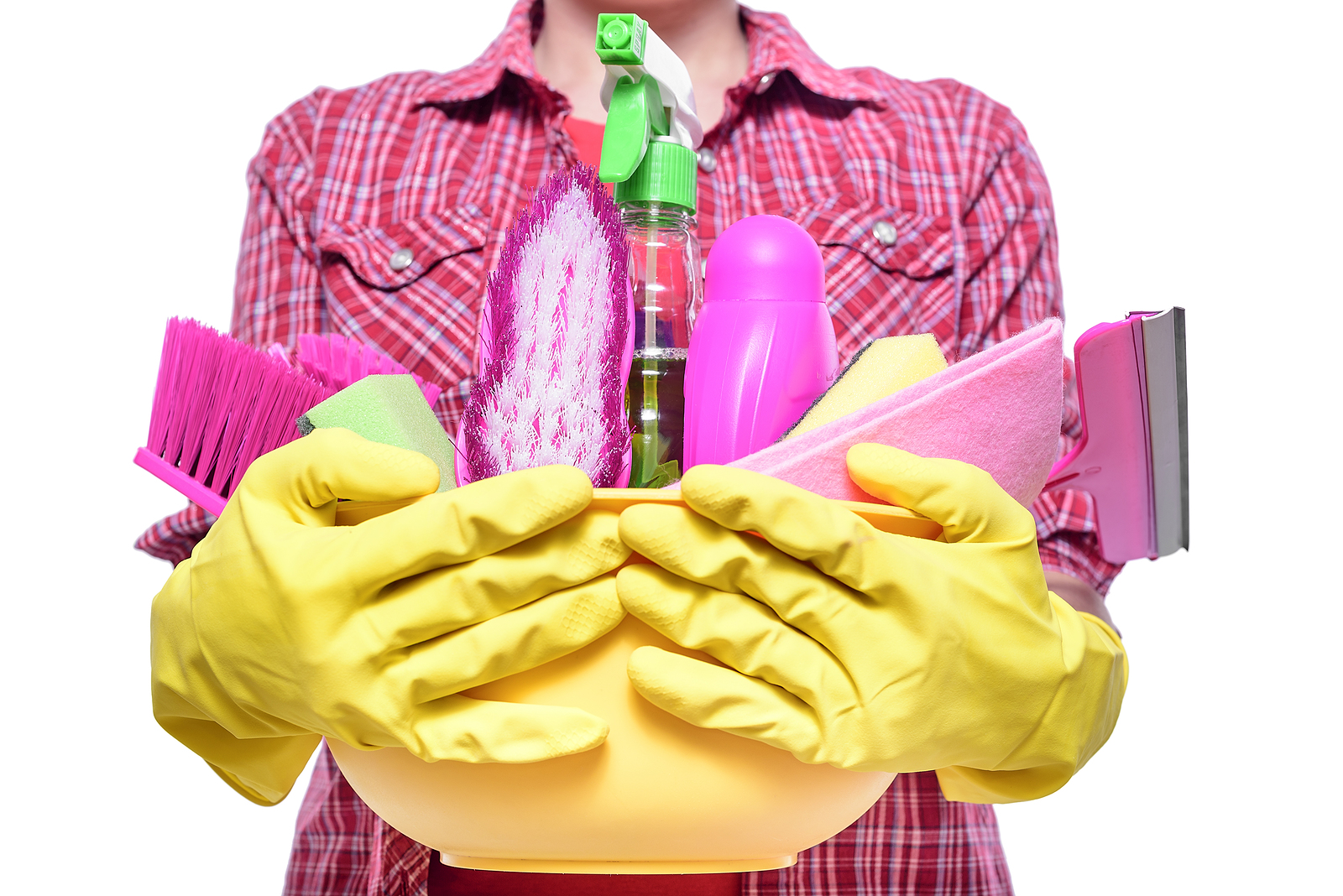 woman with an armful of cleaning supplies